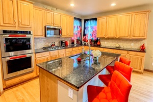 Spacious kitchen with elegant granite countertops, perfect for cooking and entertaining