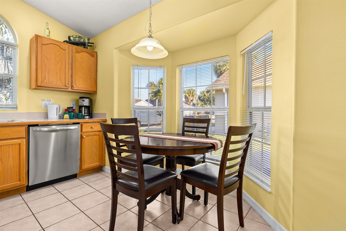 The sunny breakfast nook has seating for four.