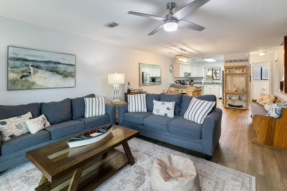 Pull out the queen sleeper sofa and the living room becomes a bedroom &mdash; eight guests, no one on the floor.