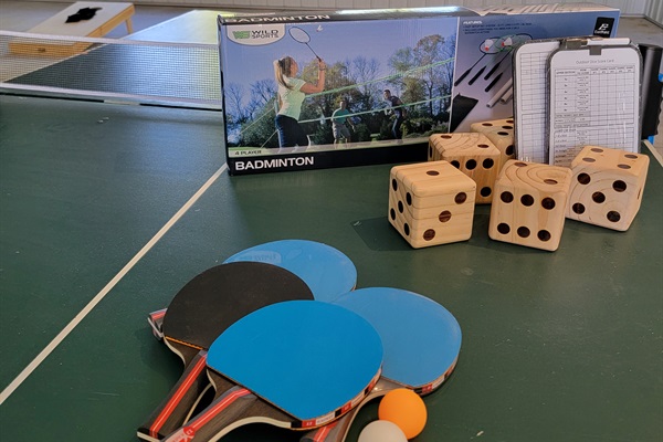 Play games regardless of the weather. 2400 s.f. of insulated indoor entertainment space. Ping pong, corn hole, badmitten, giant dice, and a jumbo bluetooth speaker.