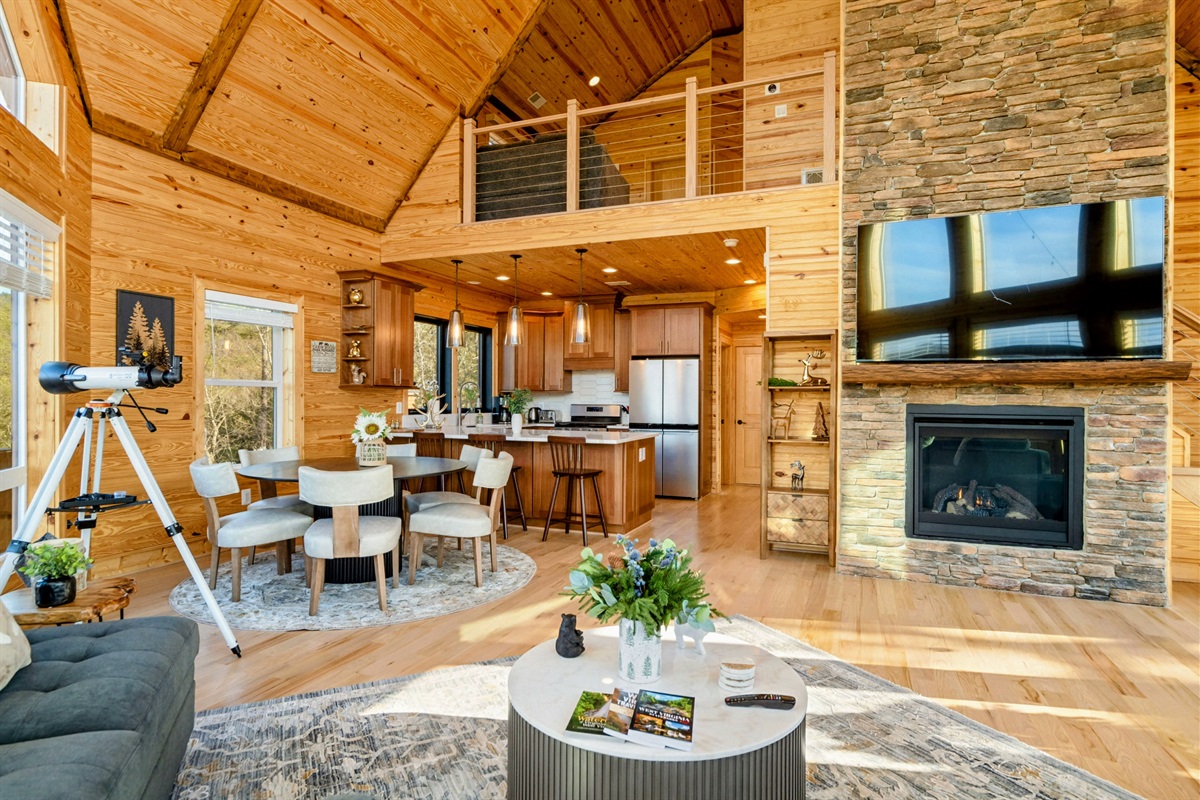 Warm Gatherings – A towering fireplace and modern kitchen invite cozy nights and festive family meals.
