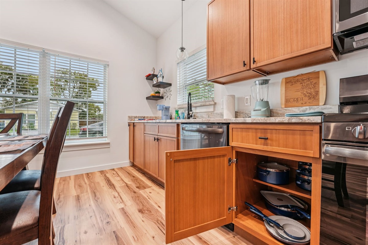 Full set of non-scratch, non-toxic pots and pans - several large pots, frying pans, flat pan, baking sheets, and single pans for cooking large to small