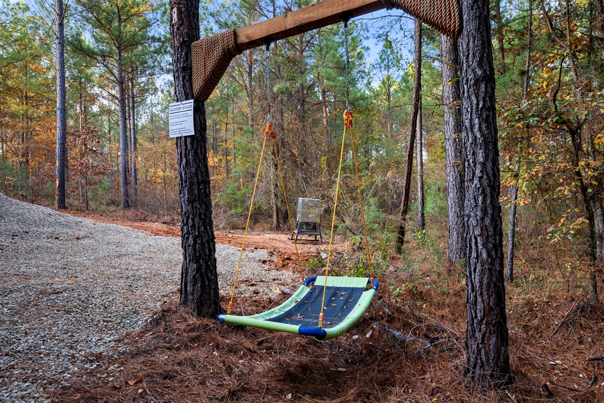 Another swing hangs just a few steps away, giving you an easy place to sway, daydream, or settle in with a book.