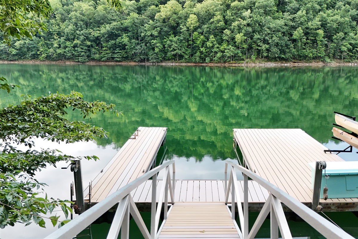 Enjoy serene lake views and relax on the dock surrounded by lush greenery!