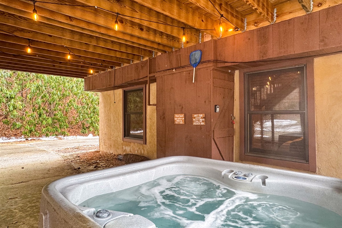 hot tub area under the covered deck overlooking the courtyard.