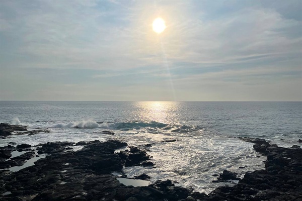 Dramatic Kona coastline just steps away — enjoy stunning sunsets and the soothing sound of the waves.