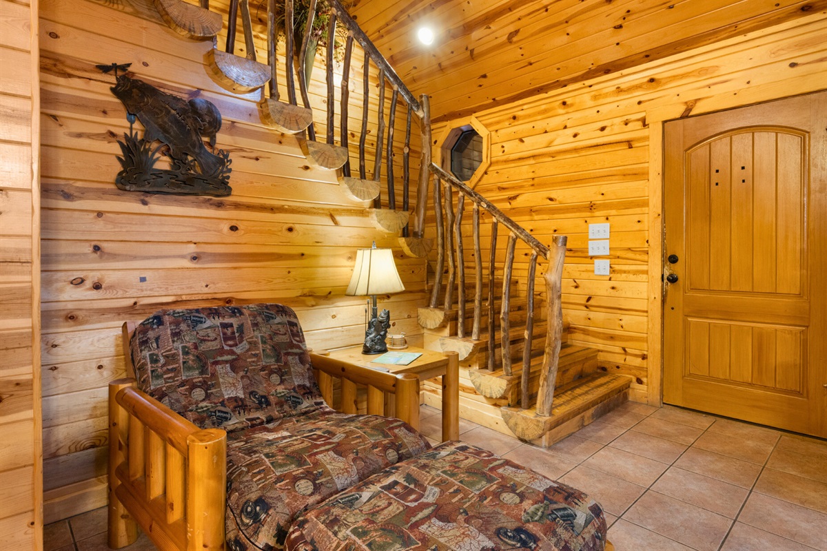 Rustic staircase and cabin charm throughout the space.