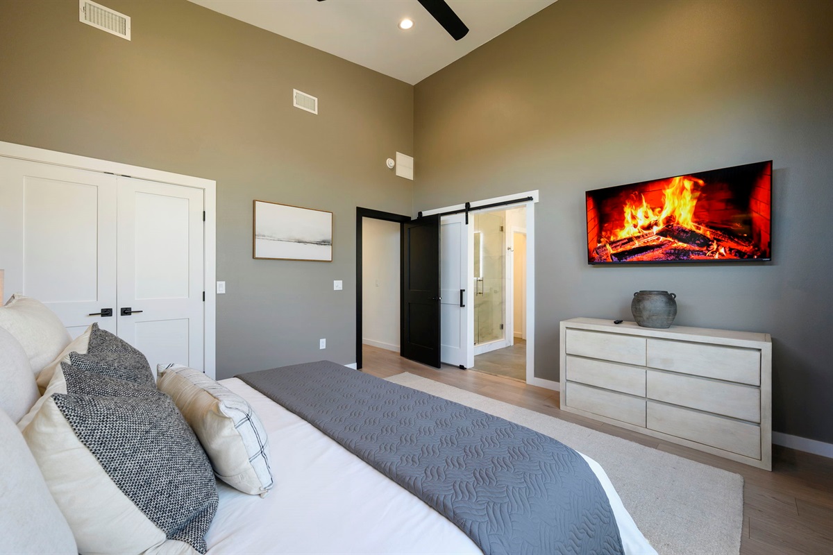 King Suite 2 - Large and spacious suite with teak wood paneling, designer finishes, smart TV, premium king mattress, and luxury bedding. Includes stunning views of the hardwood forest. 