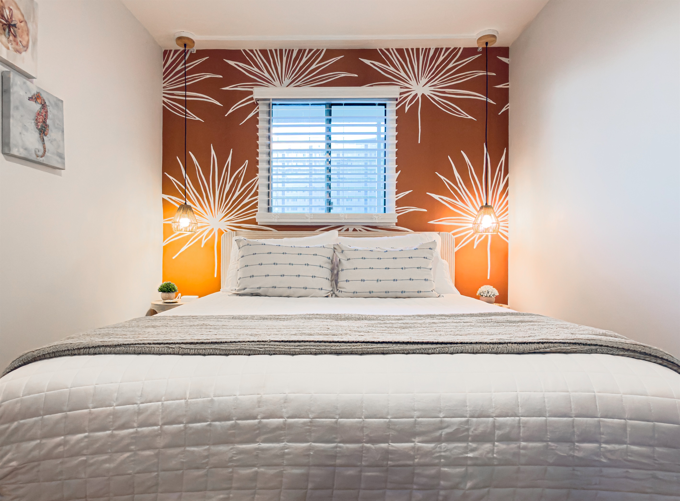 The tropical leaf mural sets a relaxing tone for your entire stay. You will feel completely at home in this calm space including a brand new Queen bed, dresser and TV.