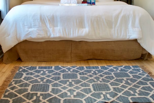 Bedroom with comfortable bed and soft linens for a peaceful night's sleep.