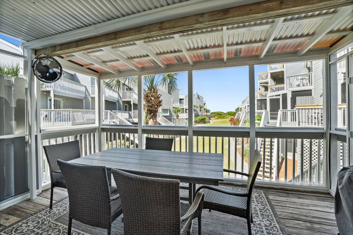 Settle into the screened porch after dinner, fan spinning overhead, the Gulf breeze doing the rest.