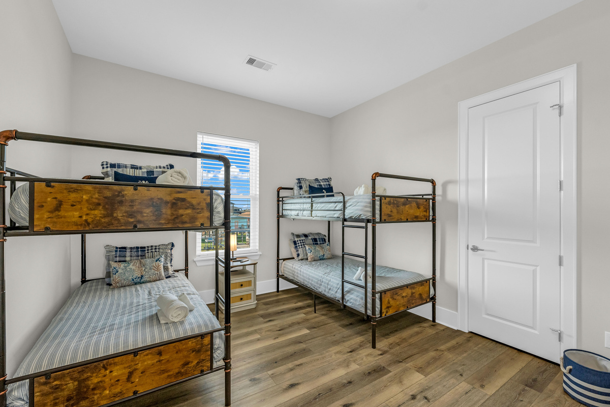 Costa Cristal Bedroom 4: This inviting bunk room combines functionality and comfort, providing a cheerful and organized space for guests of all ages.