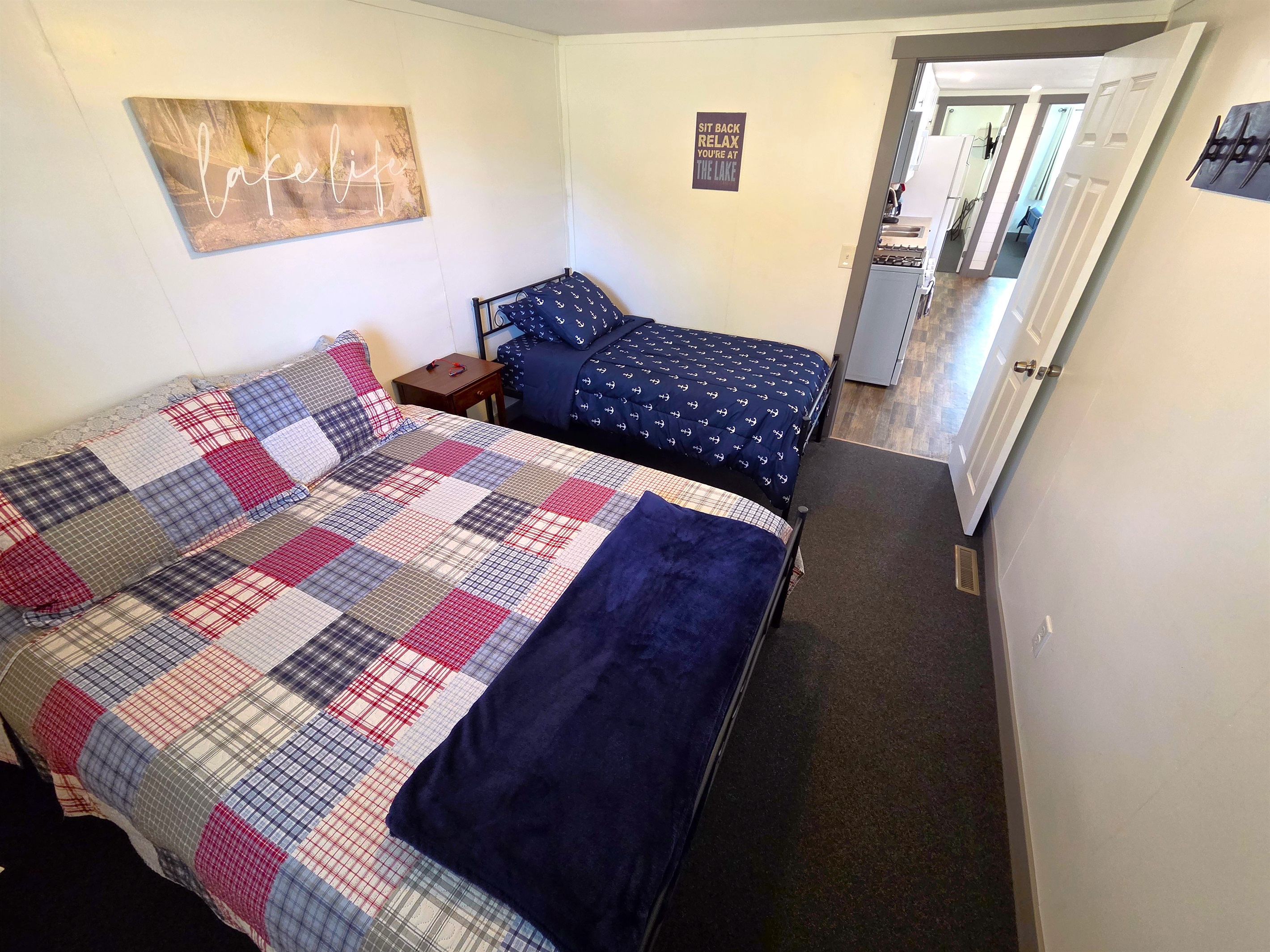 Bedroom 3 has a queen and twin bed & is off the kitchen and 3/4 shower bath.