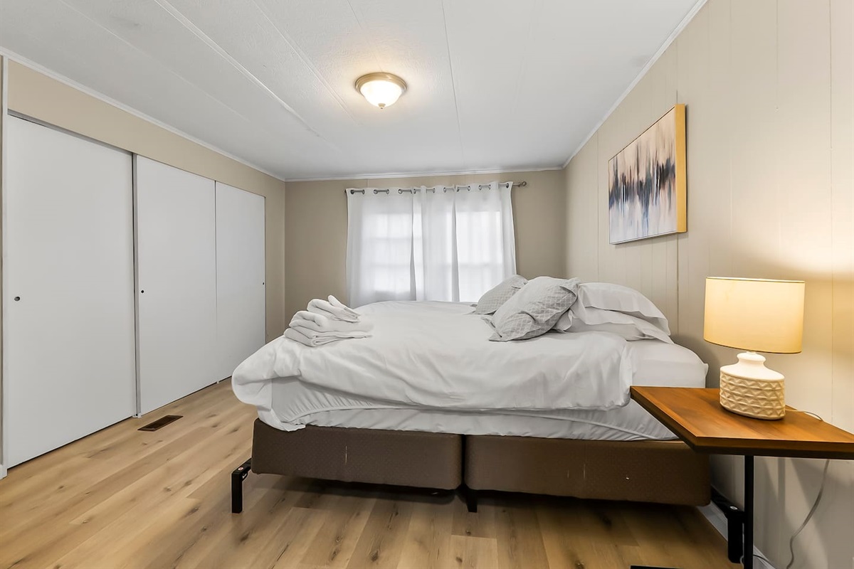 Cozy bedside lighting and ample closet space, designed for comfort and functionality.