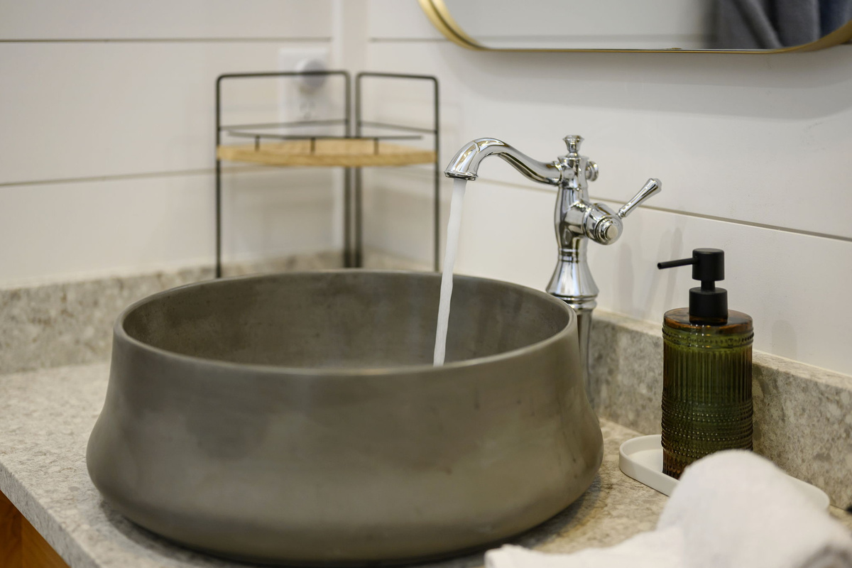 The primary ensuite bathroom offers a warm, spa-like experience with high-end finishes, luxurious touches, and a serene atmosphere designed for comfort and relaxation.