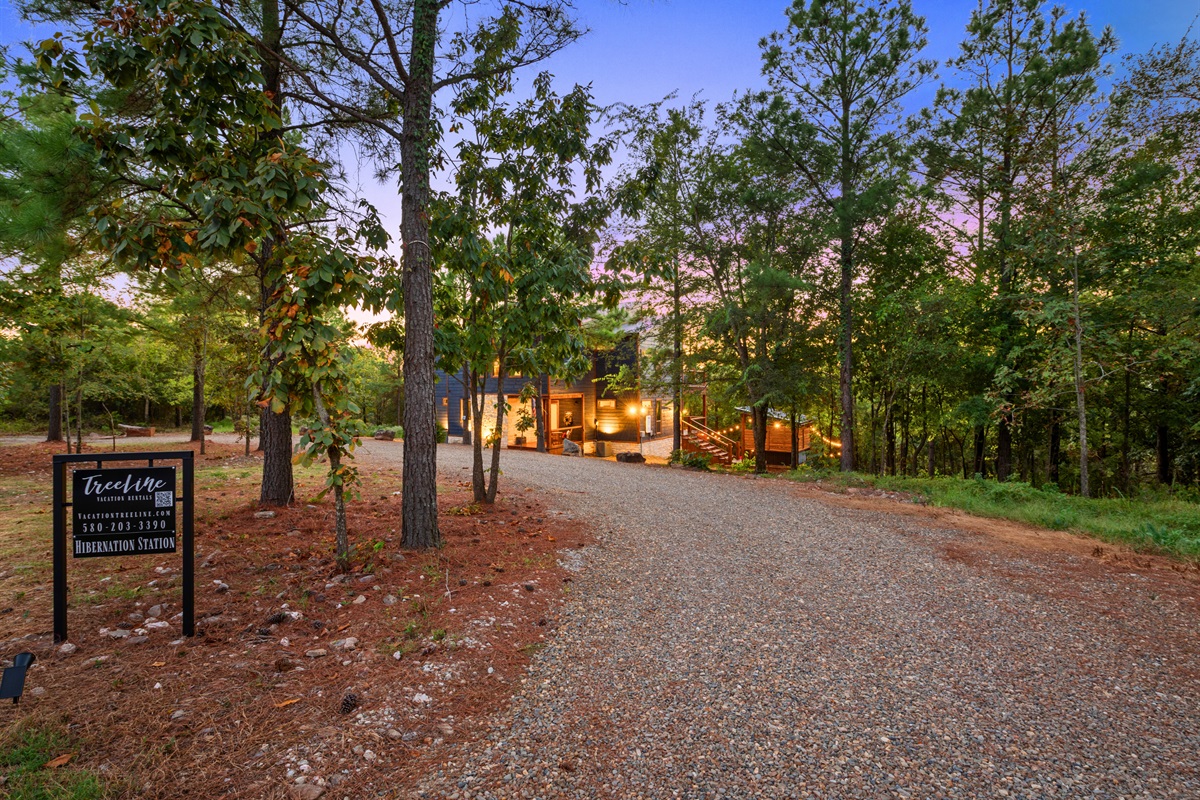The private driveway leads you into your own woodland retreat, surrounded by tall trees and fresh mountain air.