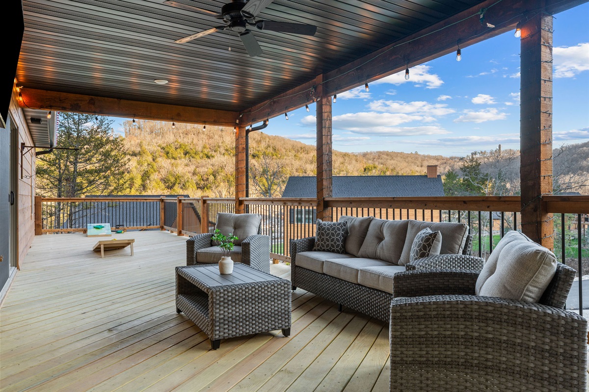 Spacious covered deck with comfortable lounge seating.