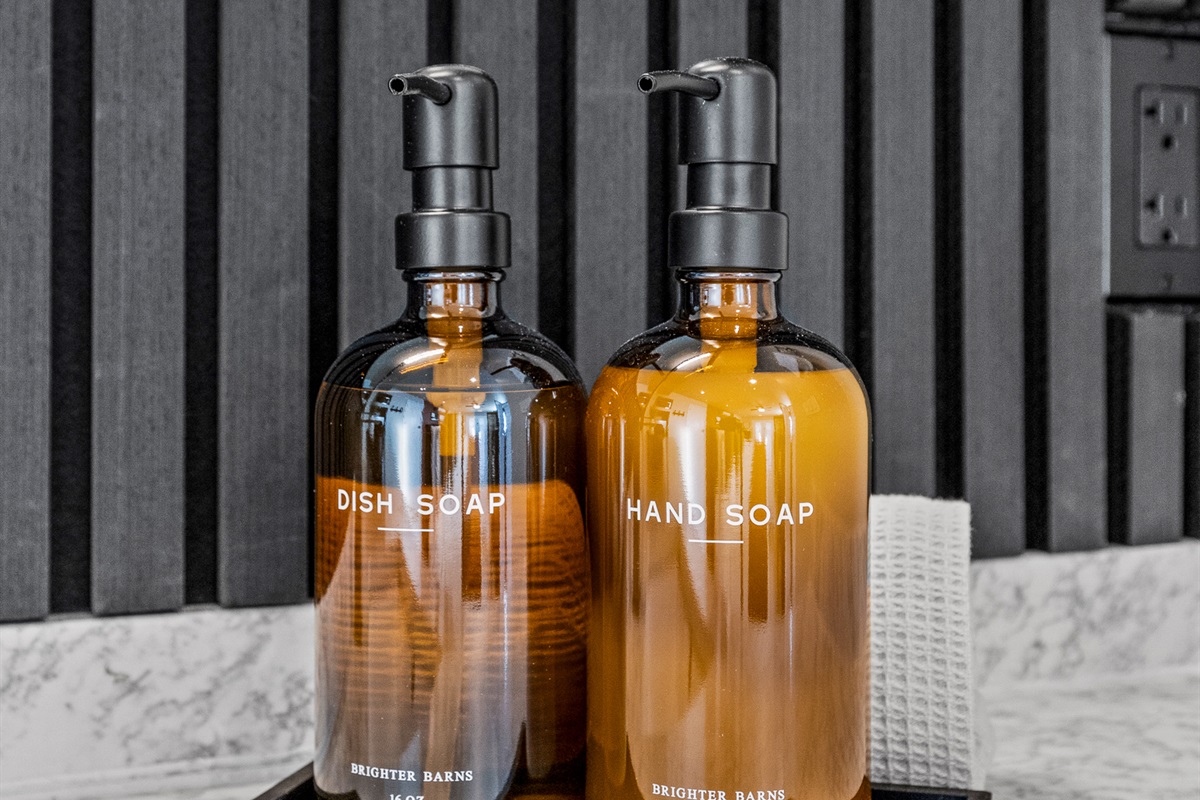 Thoughtfully stocked guesthouse bathroom with quality hand soap and essentials for a comfortable, hotel-style stay.