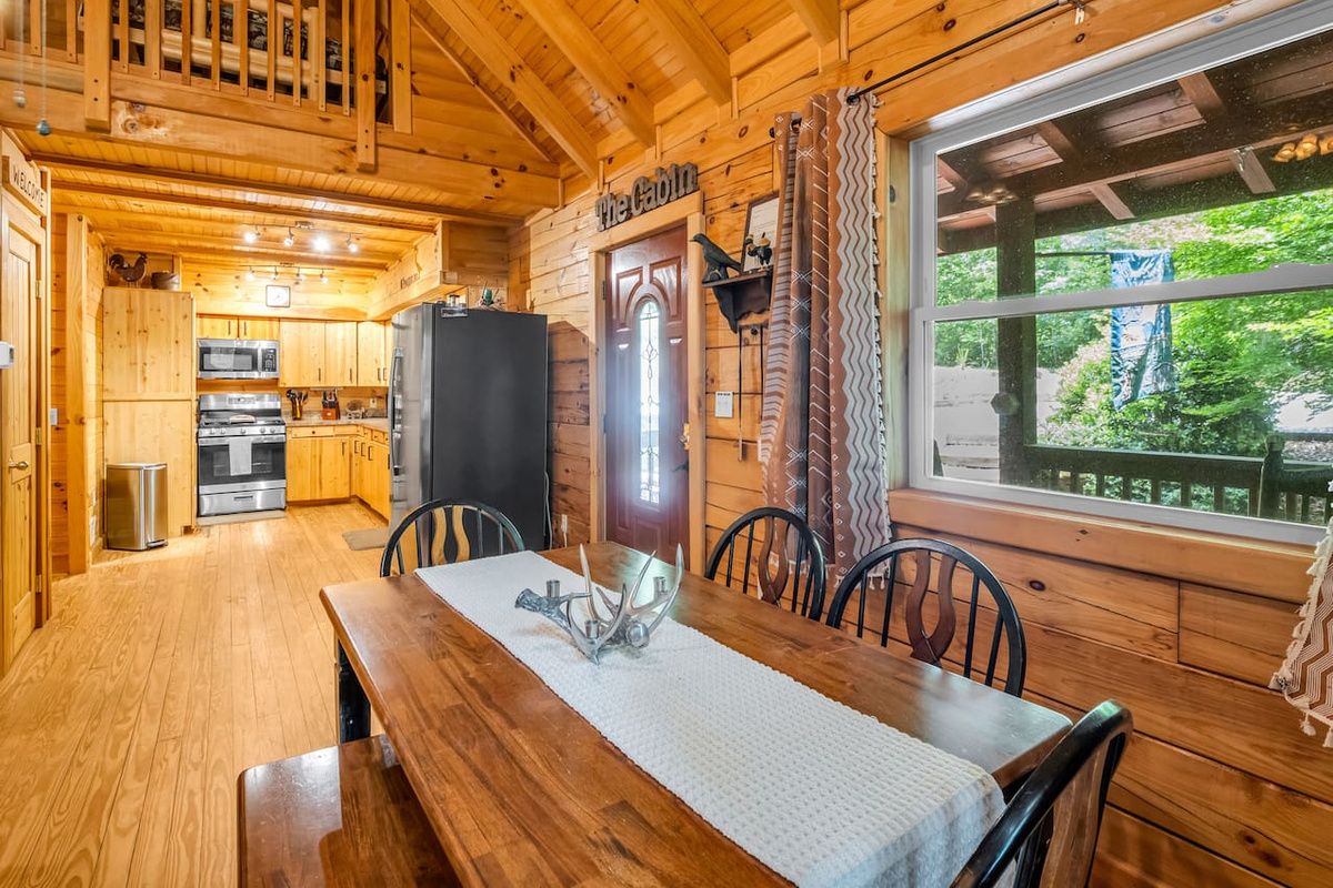 Gather around the dining table for meals, games, and conversation in this inviting open-concept space