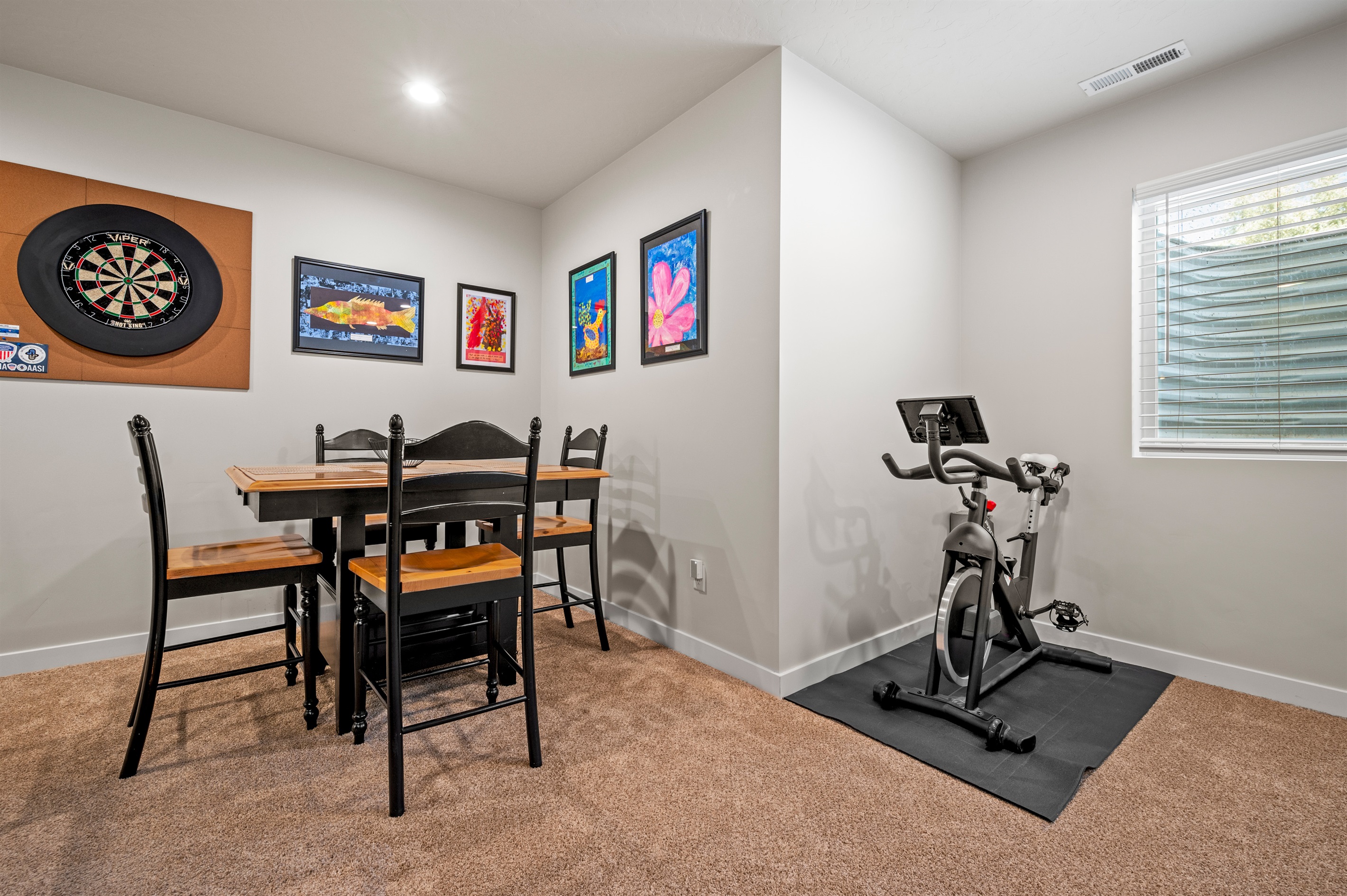 Enjoy casual meals at the dining table for four, and stay energized with an exercise bike thoughtfully placed near the window.