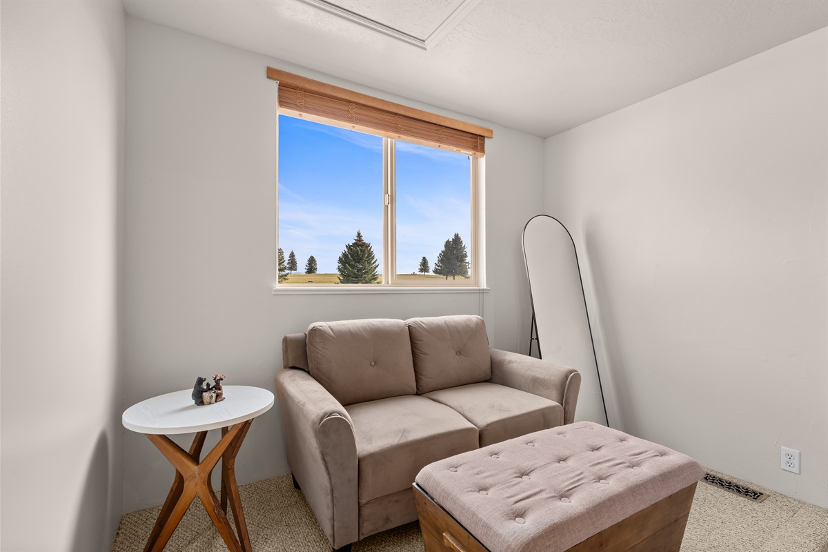 Cozy in-room seating invites you to curl up with a book or sip morning coffee.