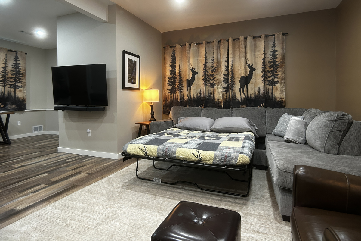 The TV can be moved to allow viewing from the bed. Room has ceiling fan, dimmable overhead lighting and room darkening curtains.