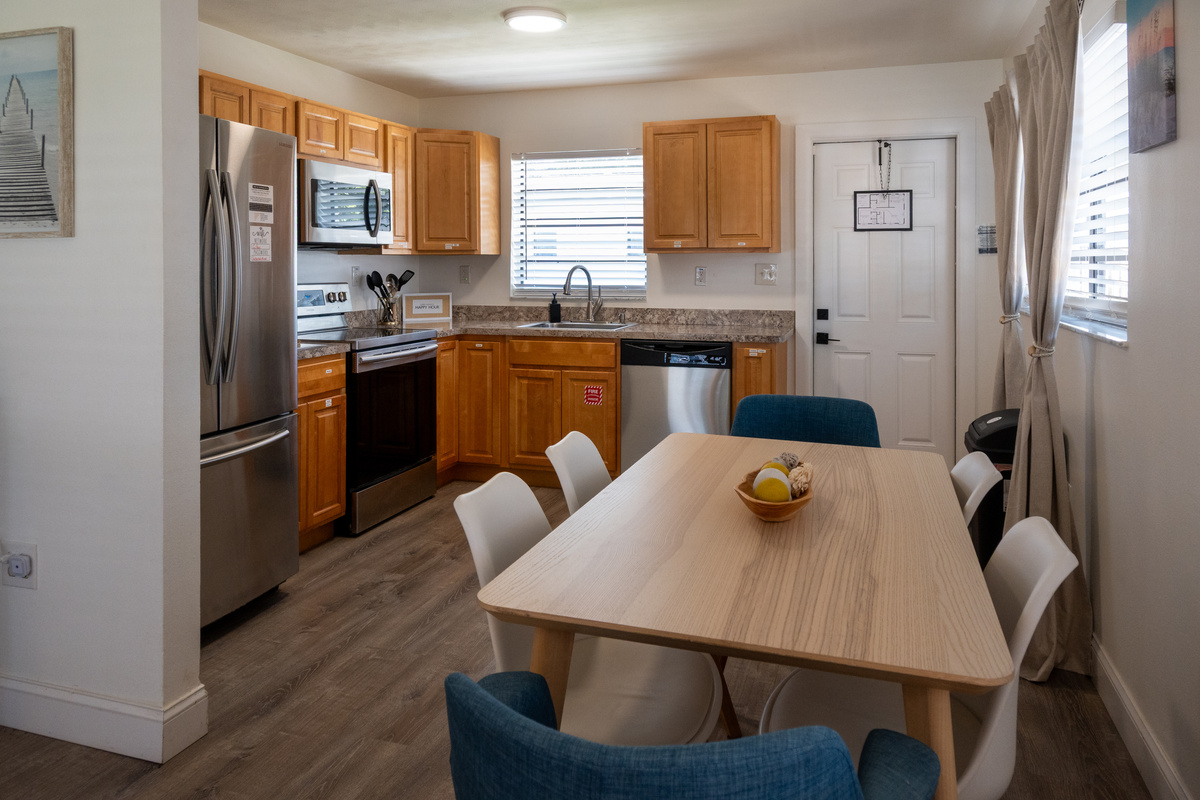 Kitchen and dining table just inside the entry