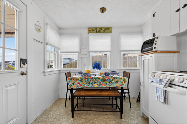 A cozy 4-seat dining area perfect for shared meals and conversation.