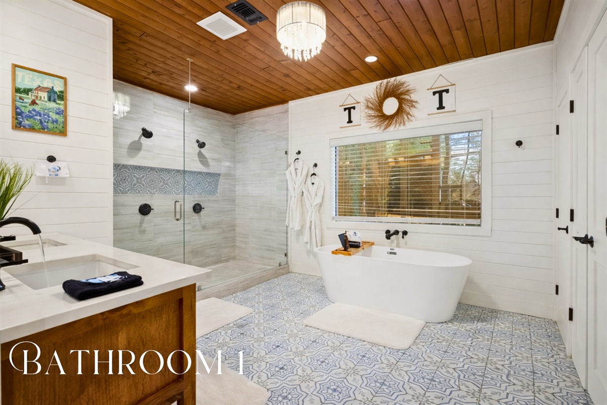 Indulge in luxury in our spa-like bathroom, featuring elegant fixtures and a serene color palette for the ultimate relaxation.