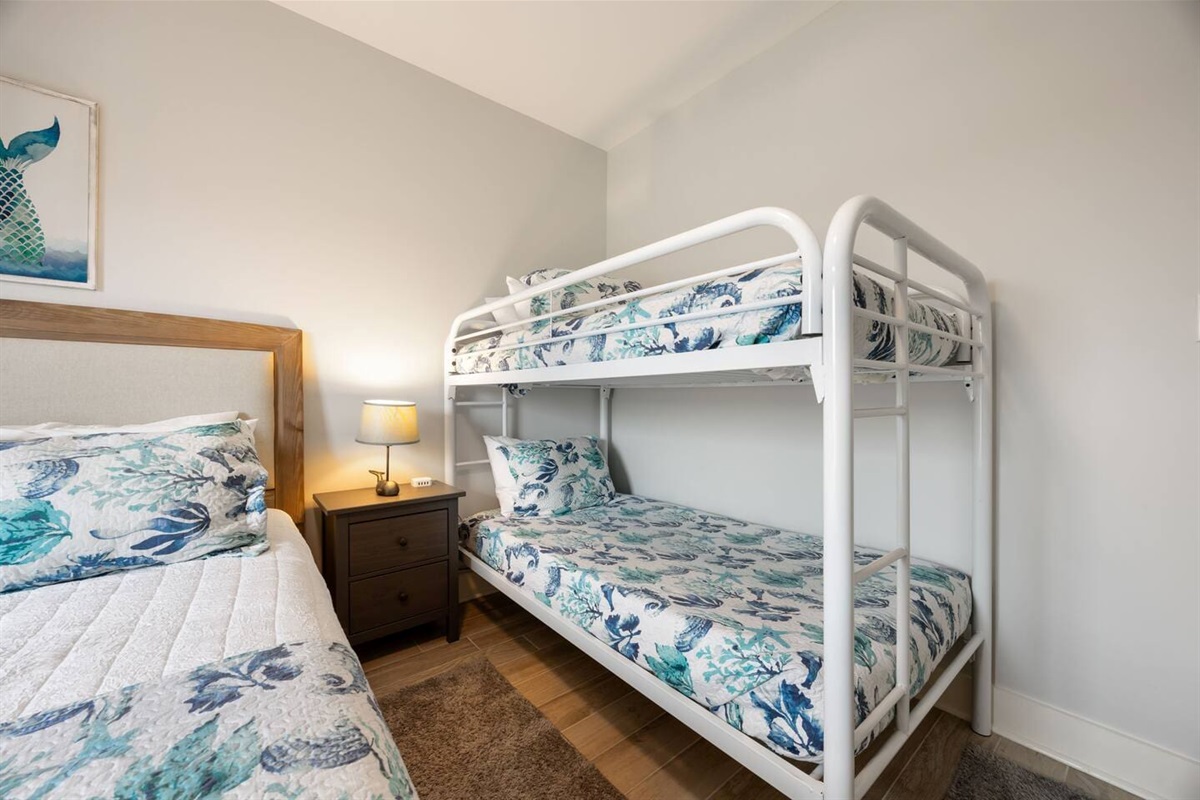 Right Guest room with queen bed and twin bunk beds