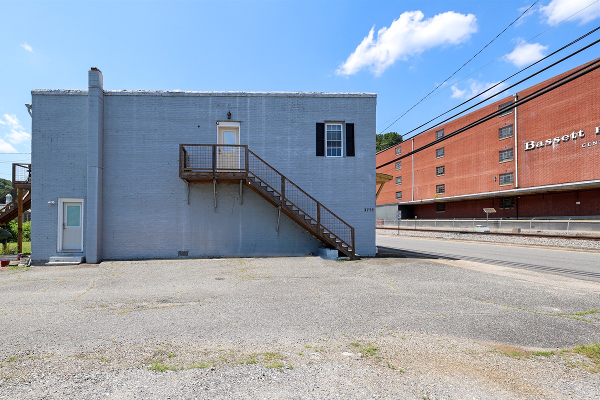 Exterior-Side view. Front entry is at the top of stairs