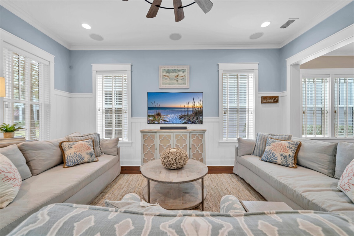 Sun-filled windows and beach-inspired d&eacute;cor create a relaxed vibe.