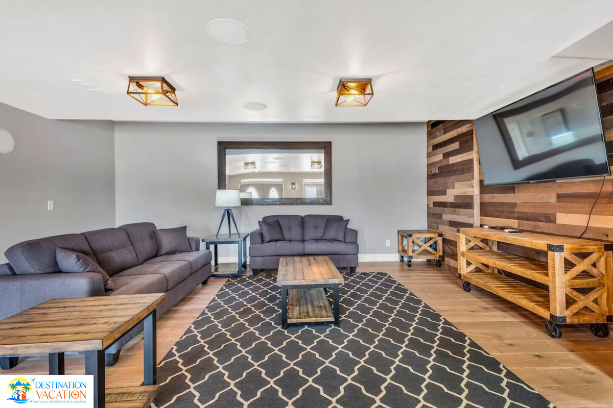 Spacious living room centered around a warm fireplace.