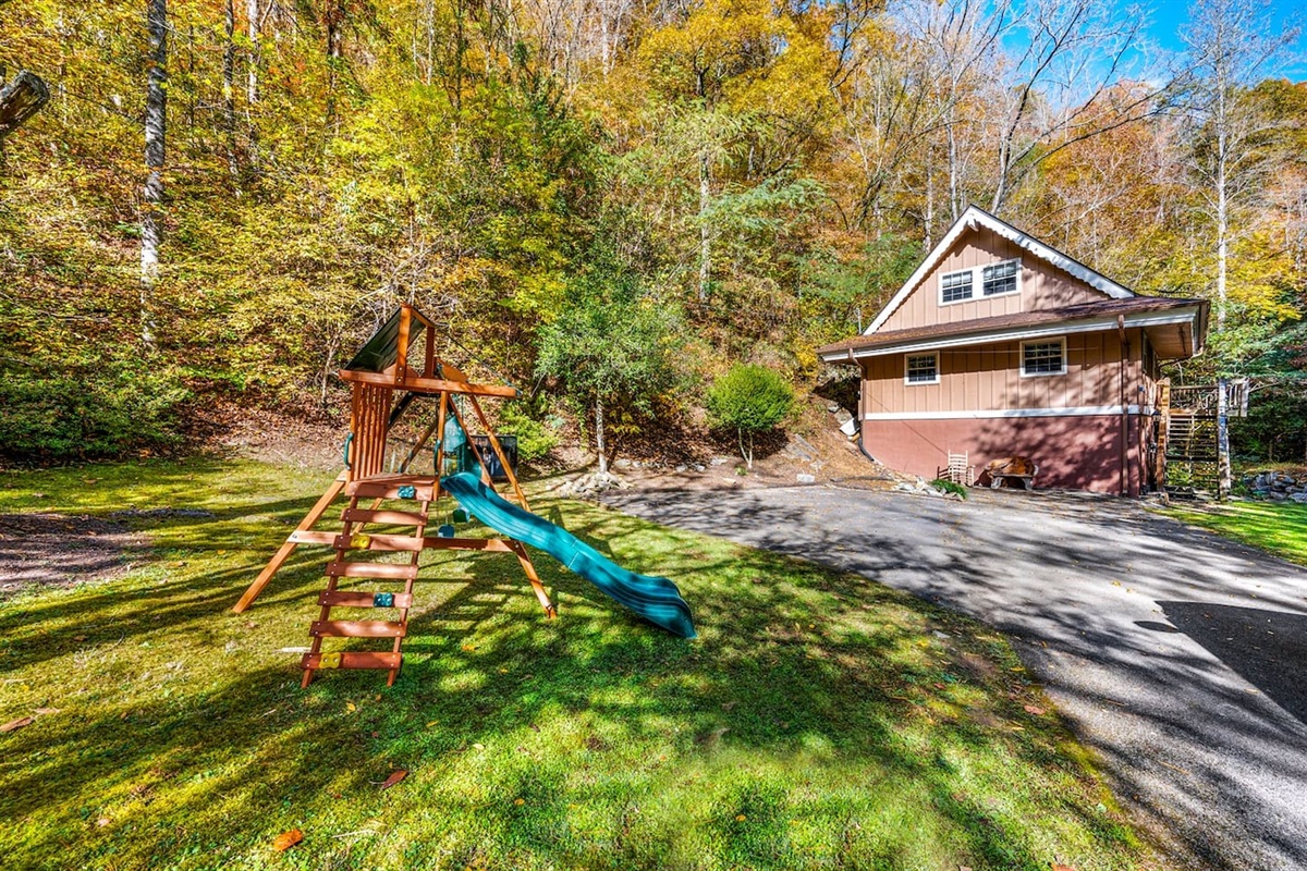 Imagine a picturesque escape where laughter fills the air as kids explore and play in their very own outdoor wonderland. This enchanting cabin boasts a private playground set against the backdrop of a tranquil creek, creating a haven for fun and adve
