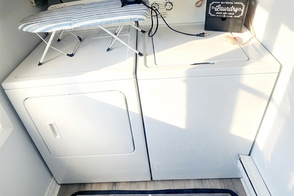 Laundry area, with iron and laundry supplies