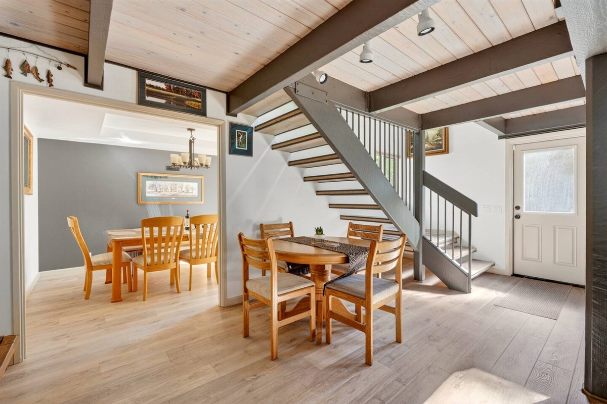 Add it like this:

A charming breakfast nook with seating for four, perfectly situated between the living and dining areas—ideal for morning coffee, casual meals, or a quick game with family.

