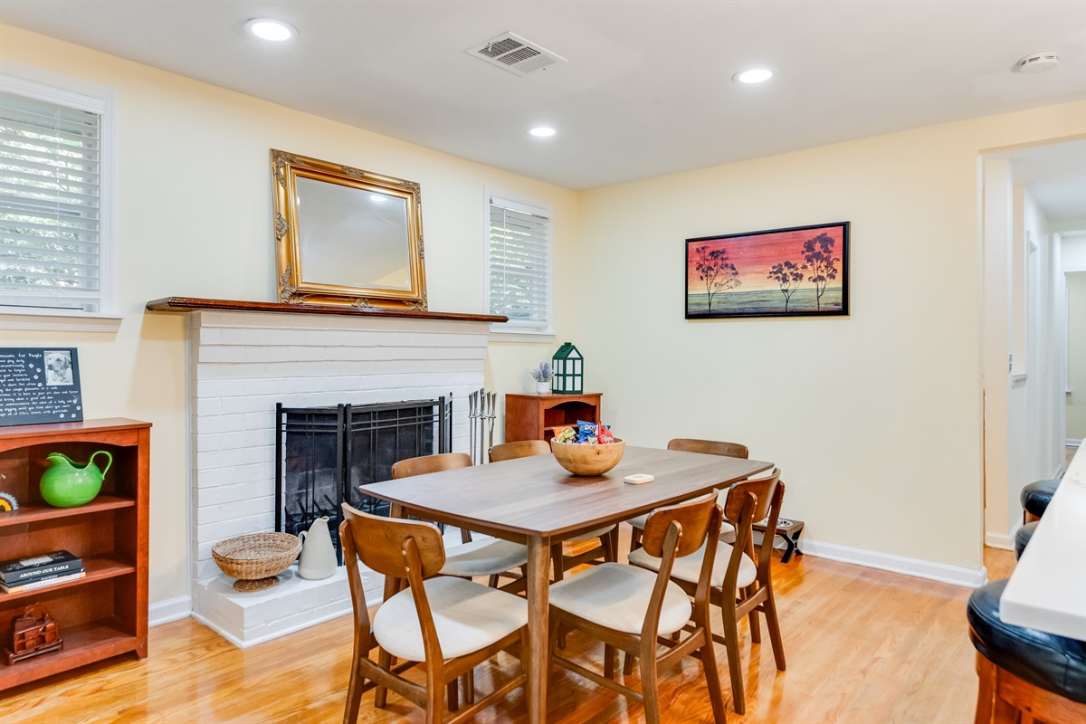 Dining Room: Gather around the stylish table and enjoy meals by the warm, inviting fireplace!