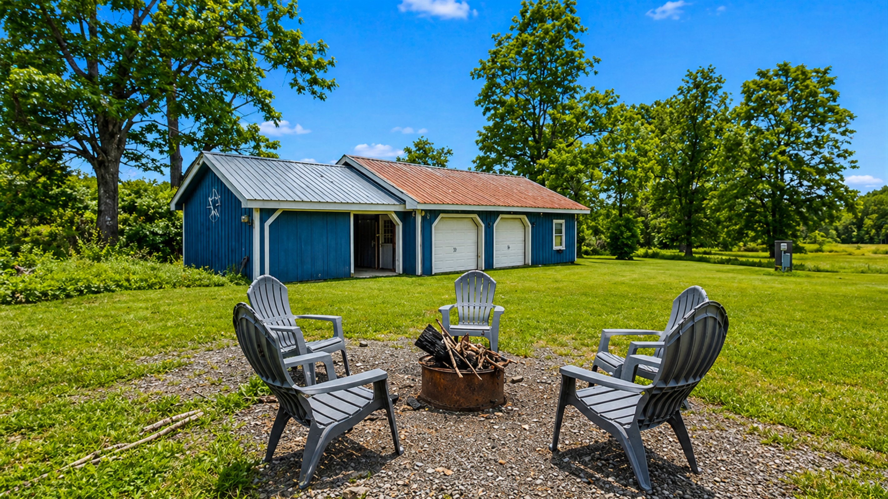 Gather around the fire pit for cozy evenings under the stars, surrounded by nature and a charming outdoor shed.
