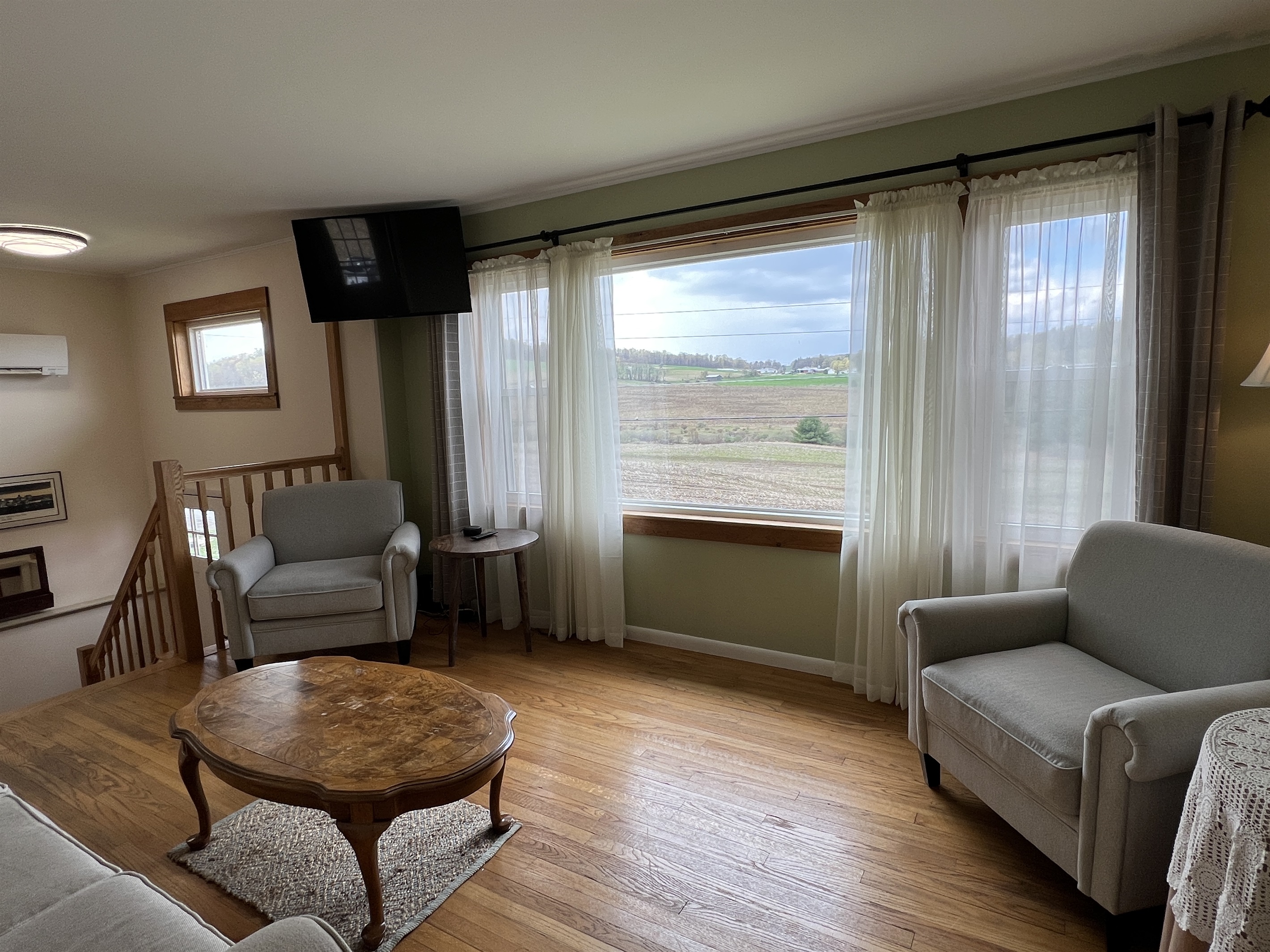 Living room with large windows to take advantage of the amazing view of the rolling hills landscape.