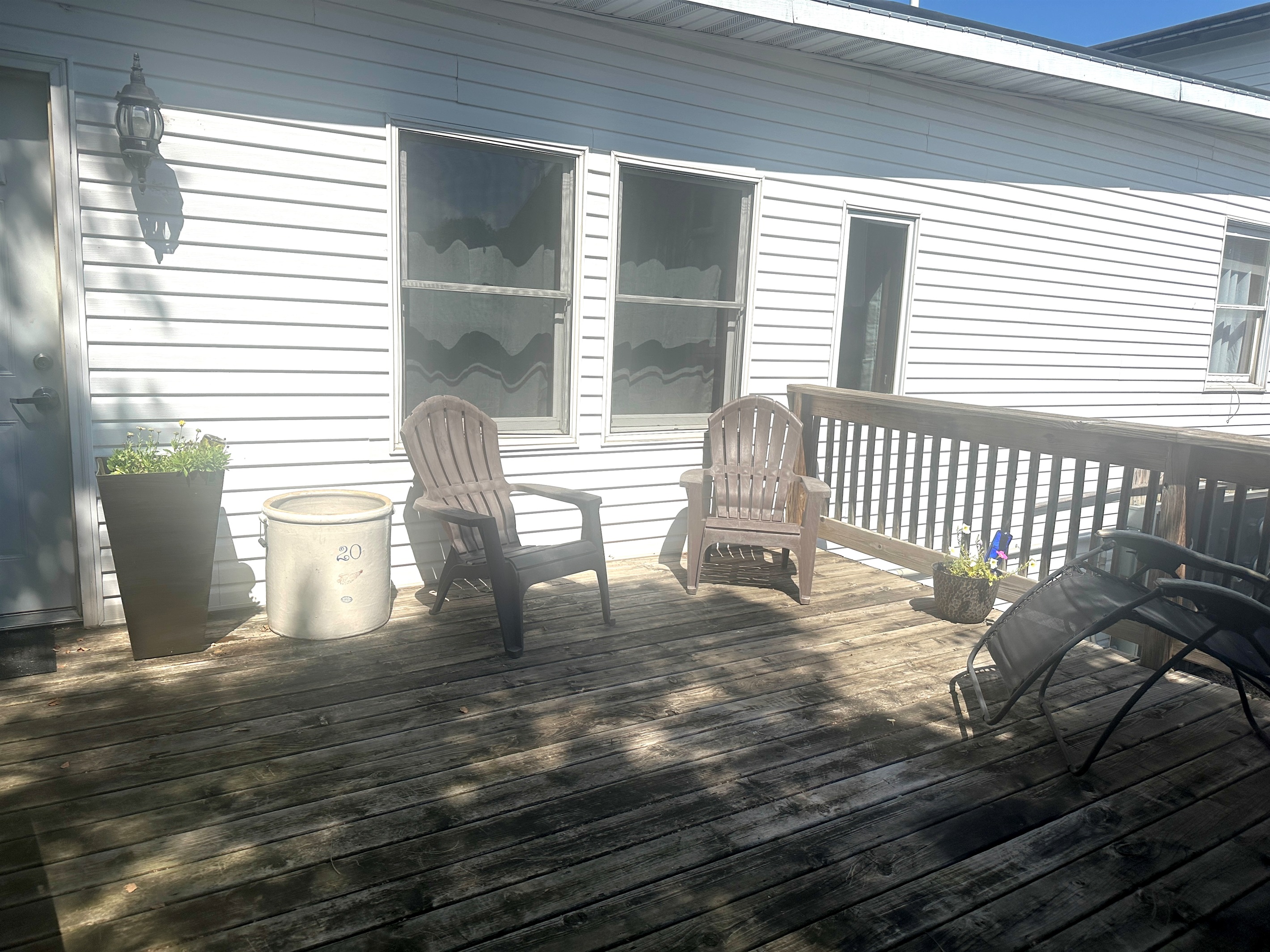 Catch the sunset from the attached deck through the neighboring trees.