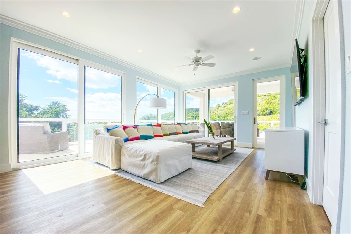 Living room offers direct access to patio.