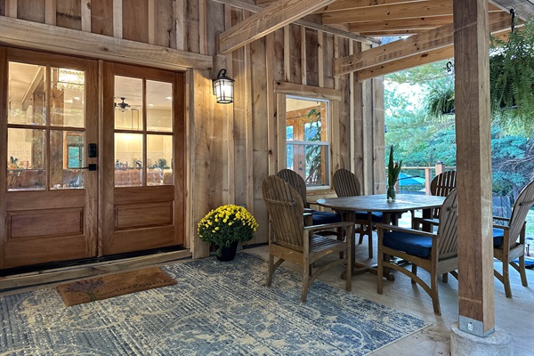 Oversized front porch with table seating for six, allows you to enjoy coffee or meals with friends while listening to the calm of the forest!  We have additional outdoor table seating for 10 on the patio overlooking the pool.