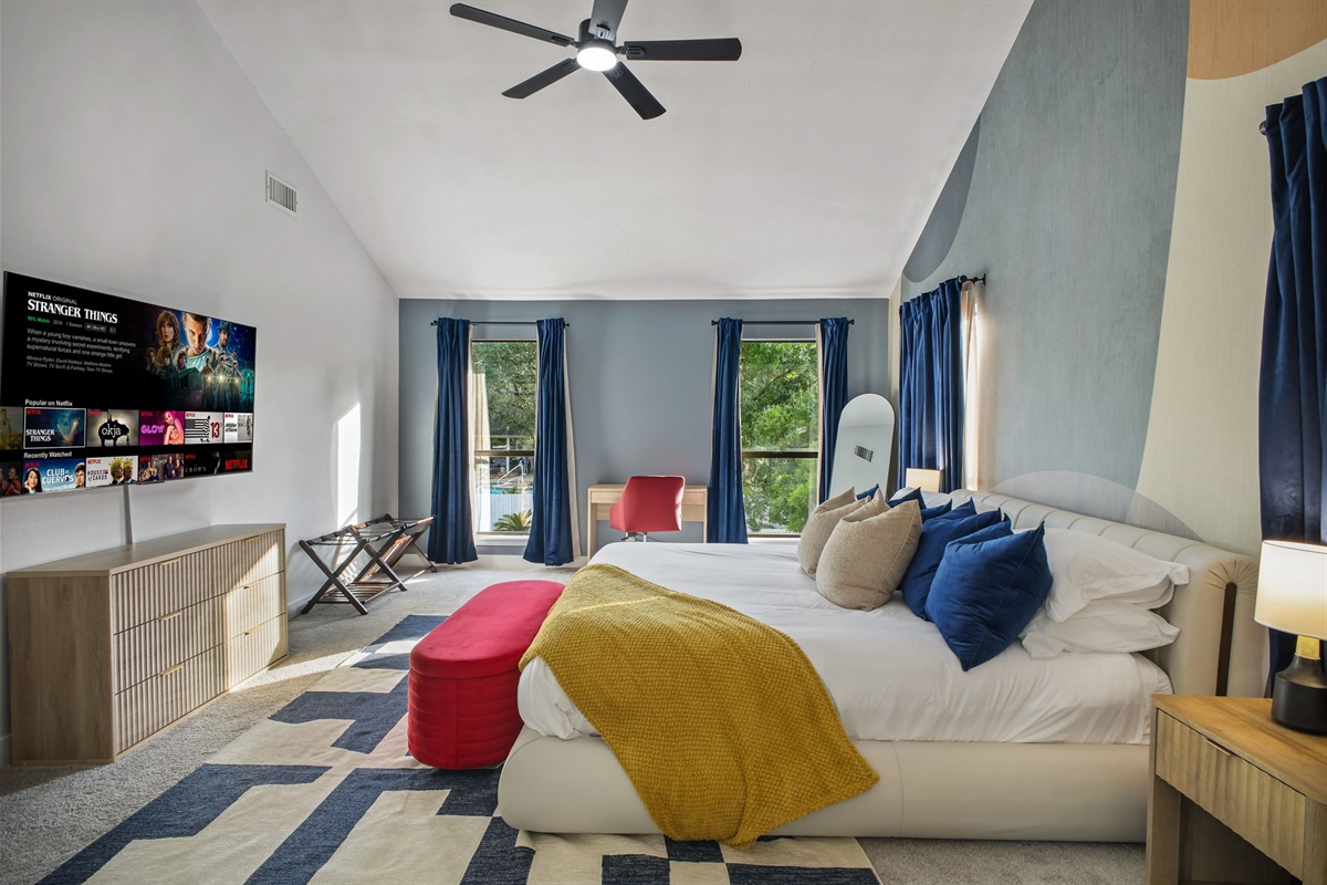 Master Bedroom: Smart TV and a dedicated desk for remote work.