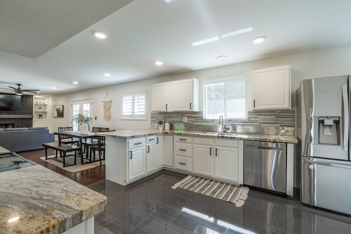 Well-stocked kitchen opens up to dining and family rooms.