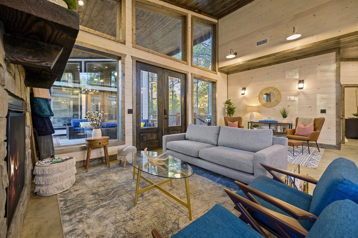 Generous ceilings and forest views give the living area an airy calm. Stretch out after a day at the lake and let the outside world slip away.