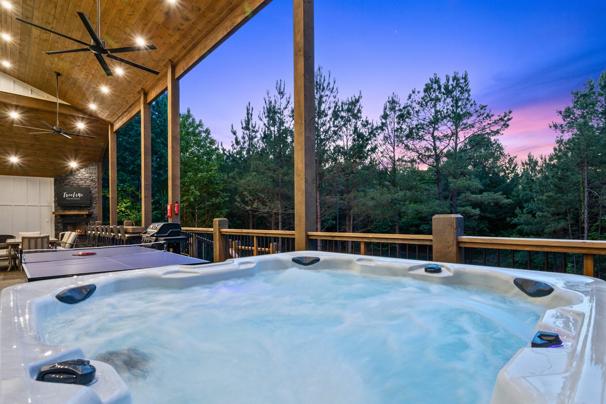 Slip into the hot tub at sunset and enjoy the quiet wooded views that surround the back deck.