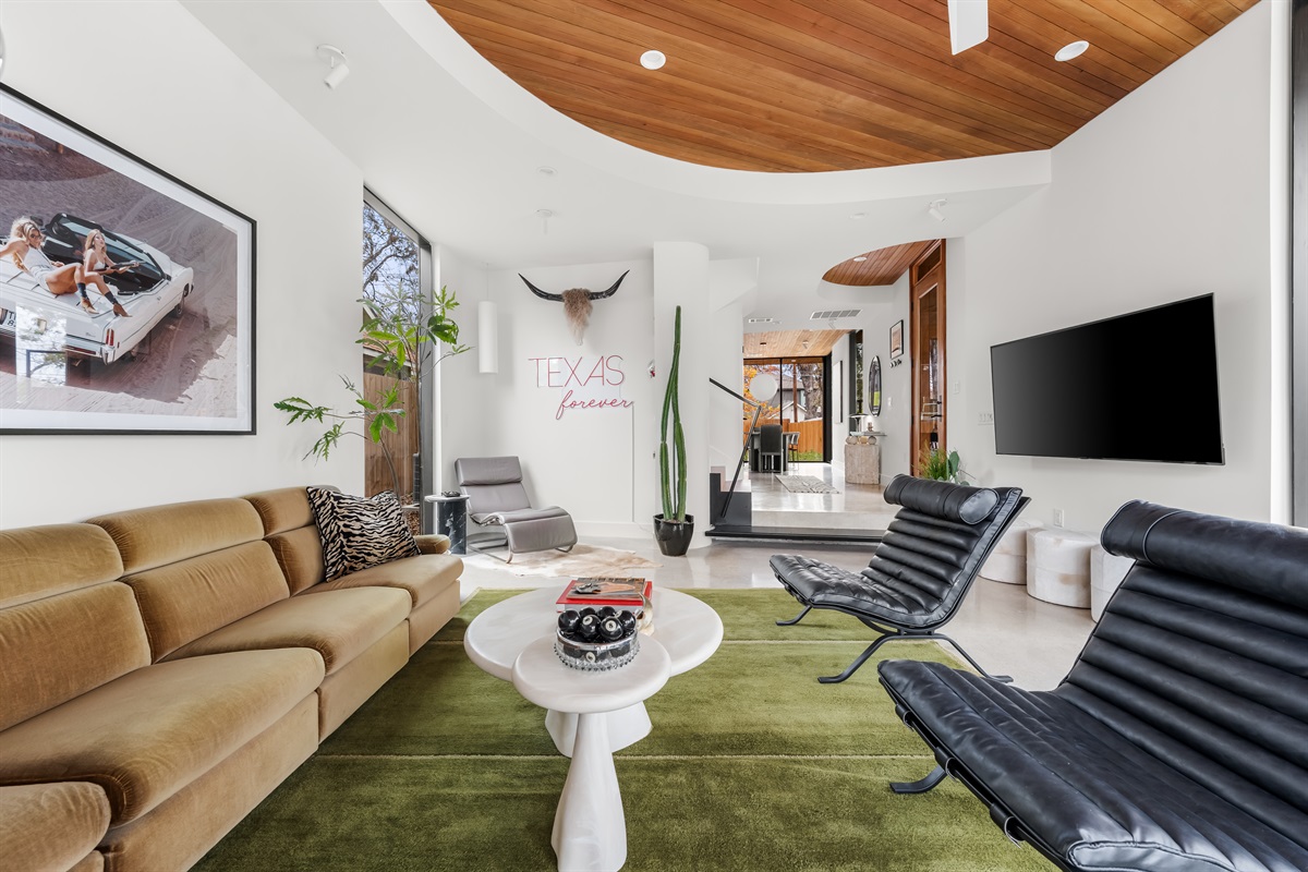 Open and stylish living space designed for relaxing, entertaining, or movie nights with the group.