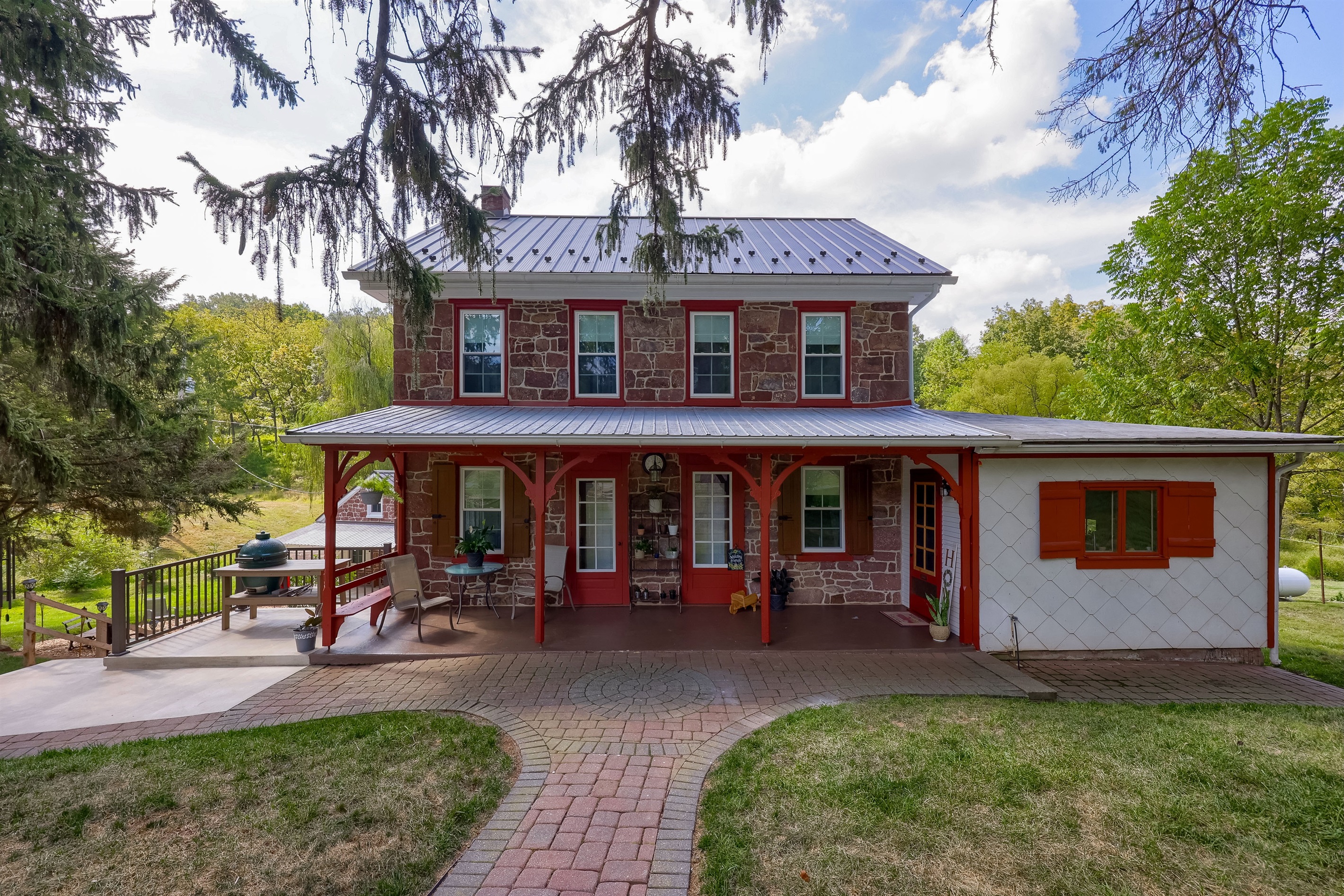 Front of Farmhouse. Entrance to the right of the porch.