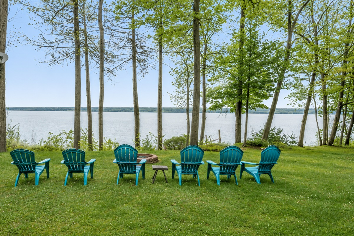 Unwind in Adirondack chairs with stunning lake views and serene forest surroundings 🌅🍃💺