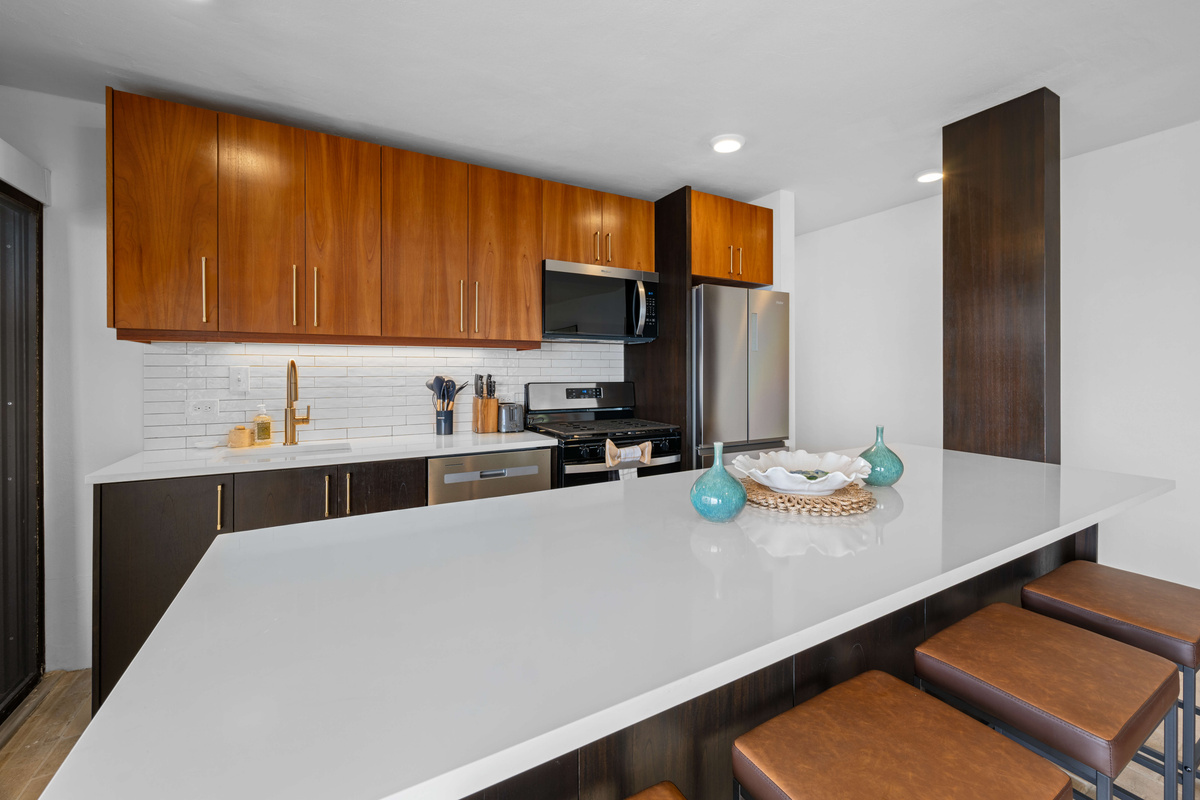 The custom cabinets contain everything you need, from a blender, toaster, mugs, and more. The dishwasher makes clean up a breeze!